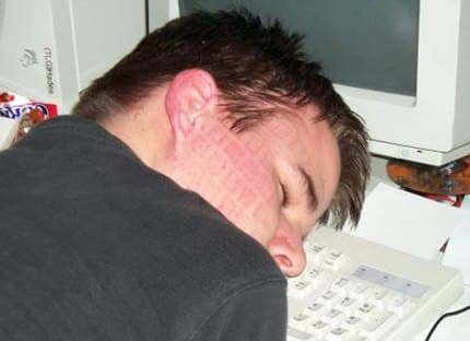 Guy falling asleep on keybord